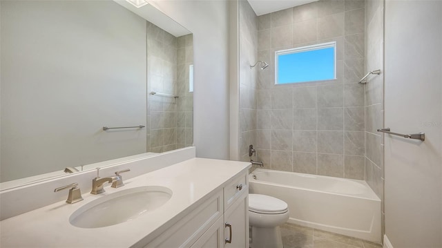 full bathroom featuring vanity, toilet, tile patterned flooring, and tiled shower / bath