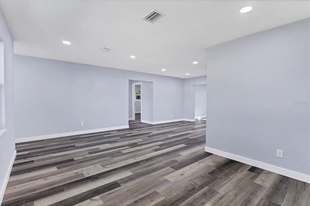 unfurnished room with recessed lighting, visible vents, and baseboards