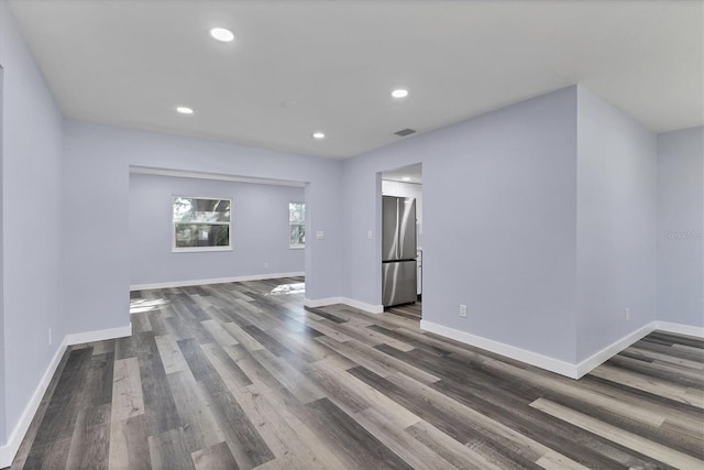 unfurnished living room with hardwood / wood-style flooring