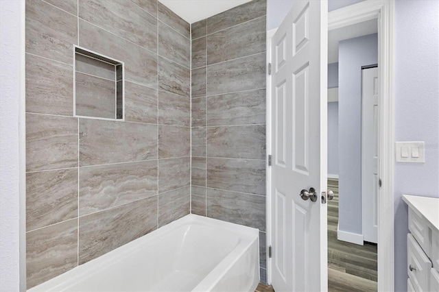 bathroom with wood finished floors and vanity