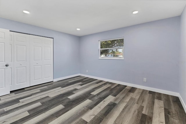 unfurnished bedroom featuring recessed lighting, baseboards, and wood finished floors