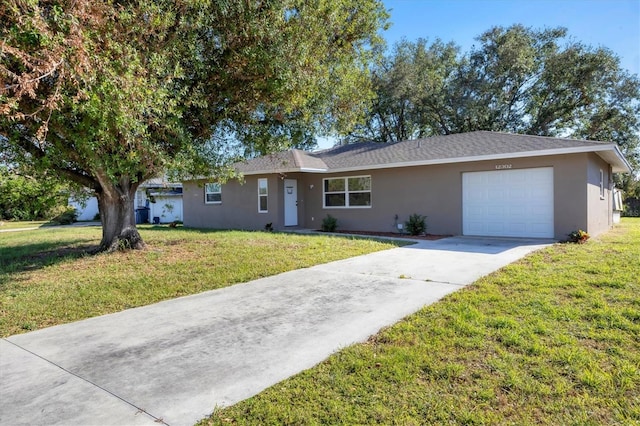 single story home featuring stucco siding, an attached garage, concrete driveway, and a front lawn