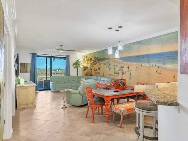 tiled dining area featuring ceiling fan and ornamental molding