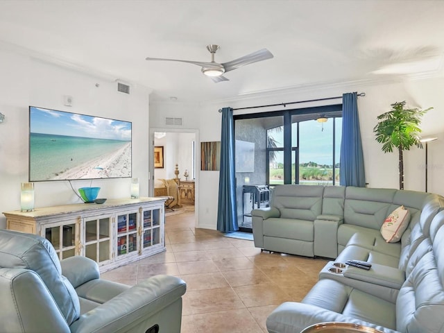 living room featuring ceiling fan, ornamental molding, and light tile patterned flooring