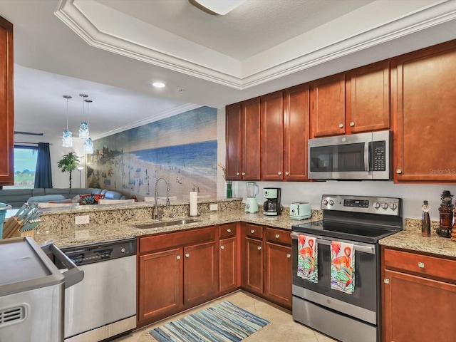 kitchen with light stone counters, sink, ornamental molding, and stainless steel appliances