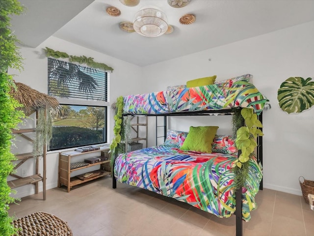 bedroom with light tile patterned floors