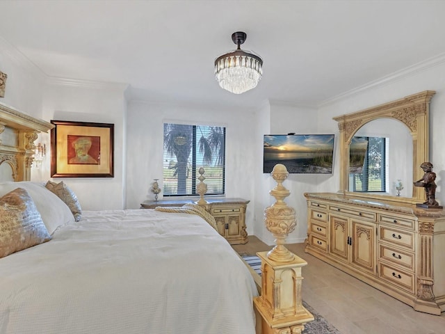 bedroom with a chandelier and crown molding