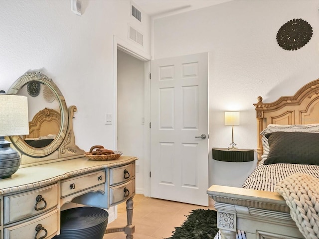 bedroom featuring light tile patterned floors