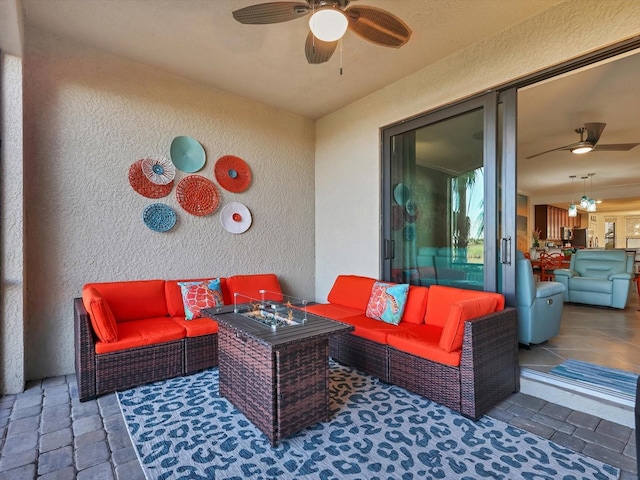 view of patio featuring an outdoor living space and ceiling fan