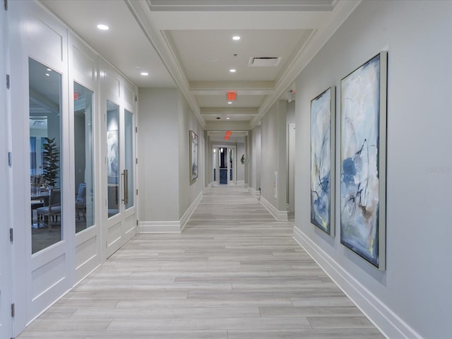 hall with beam ceiling, french doors, coffered ceiling, and light wood-type flooring