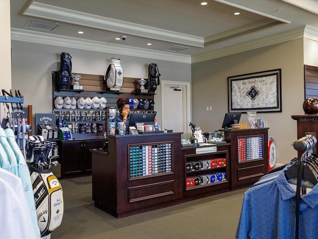 interior space with carpet floors, crown molding, and a tray ceiling