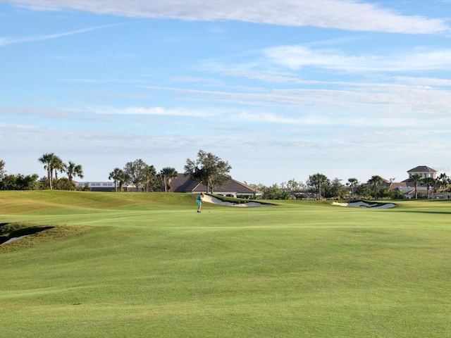 view of home's community with a lawn