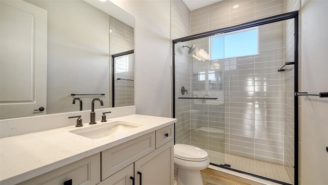 10142 Crystal Isles Cir, Sarasota, FL 34241 - full bathroom with a stall shower, vanity, and wood finished floors
