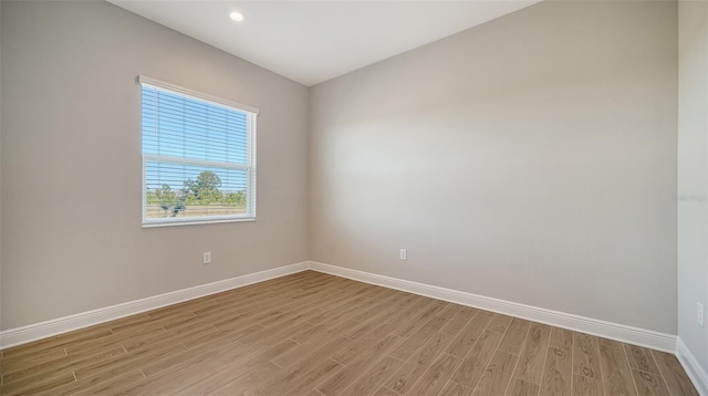 spare room with light hardwood / wood-style floors