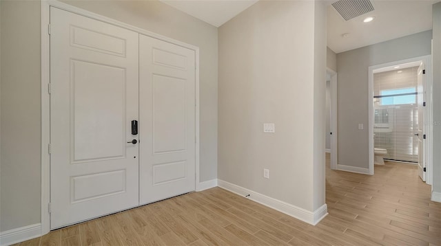 entryway with light hardwood / wood-style flooring