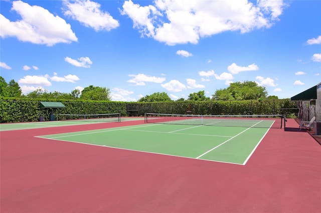 view of tennis court featuring basketball court