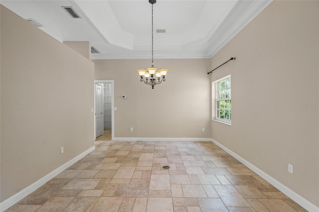 unfurnished room with a chandelier, a tray ceiling, and crown molding