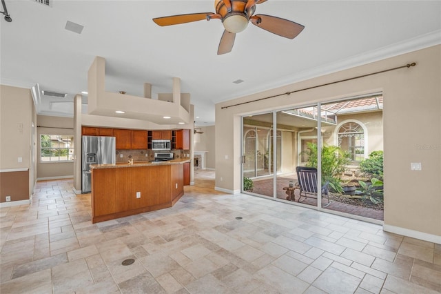 kitchen featuring ceiling fan, stainless steel appliances, light stone counters, backsplash, and crown molding