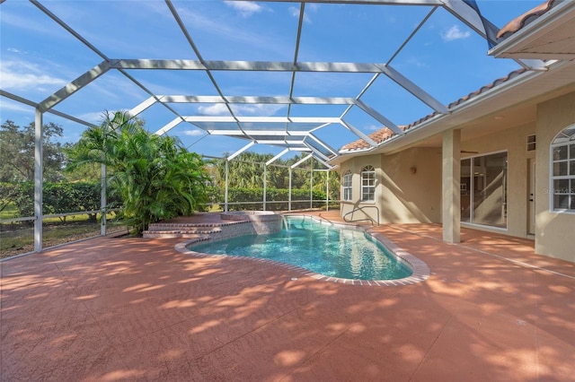 view of pool featuring a lanai and a patio area