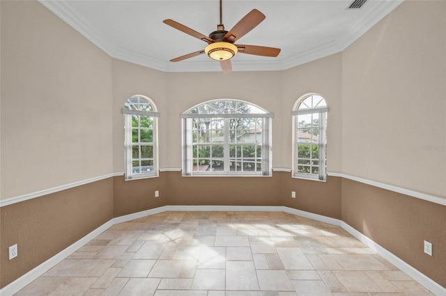 unfurnished room featuring ceiling fan and crown molding