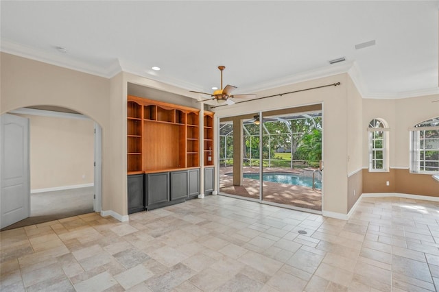 unfurnished living room featuring crown molding