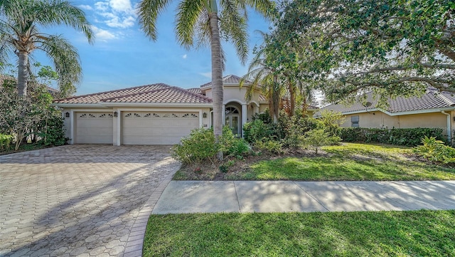 view of front of property with a garage