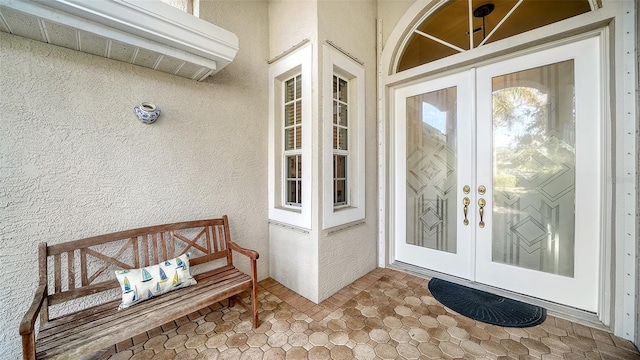 view of exterior entry featuring french doors