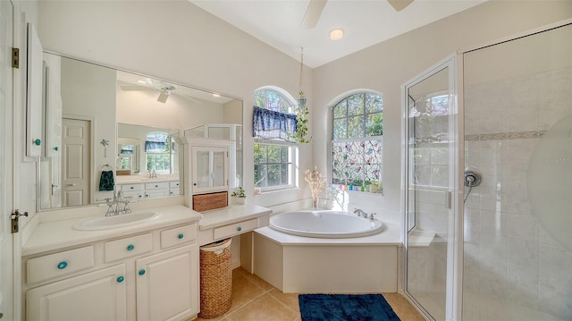 bathroom with tile patterned floors, vanity, ceiling fan, and shower with separate bathtub