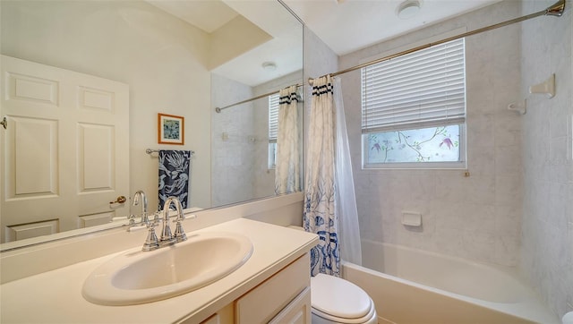 full bathroom with vanity, toilet, and shower / tub combo