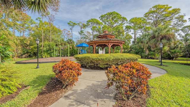 view of home's community with a gazebo and a yard