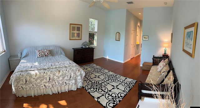 bedroom with dark wood-type flooring and ceiling fan