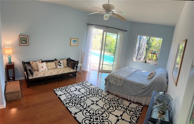 bedroom featuring access to exterior, hardwood / wood-style flooring, and ceiling fan