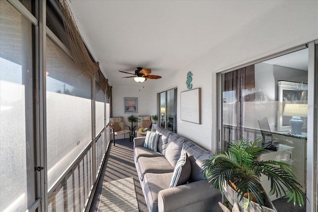 sunroom with a wealth of natural light and ceiling fan