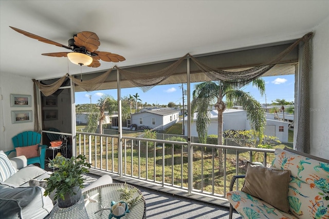 sunroom / solarium with ceiling fan and a healthy amount of sunlight