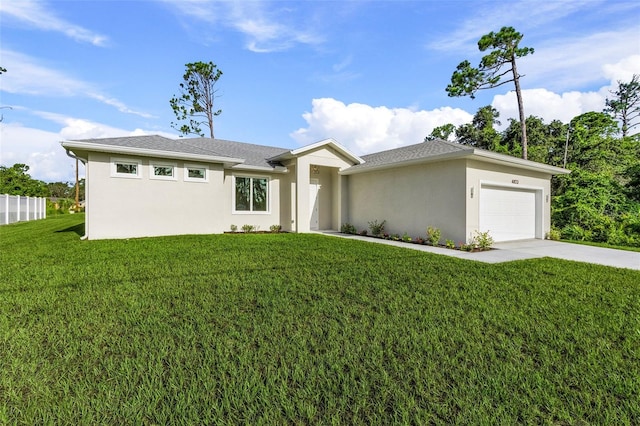 view of front of house with a front yard and a garage