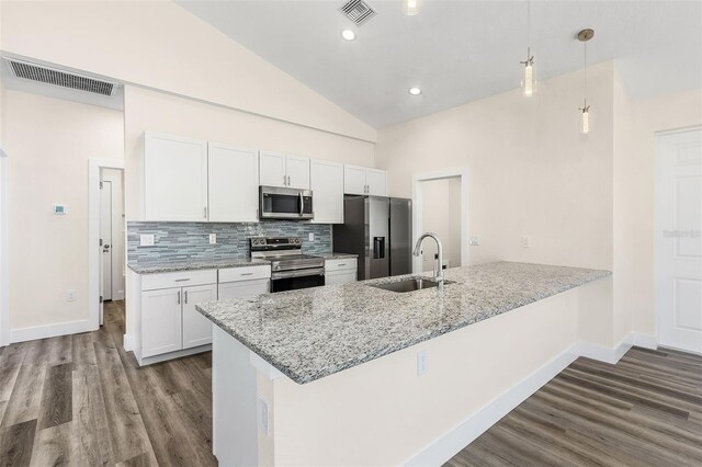 kitchen featuring sink, stainless steel appliances, dark hardwood / wood-style floors, decorative light fixtures, and white cabinets