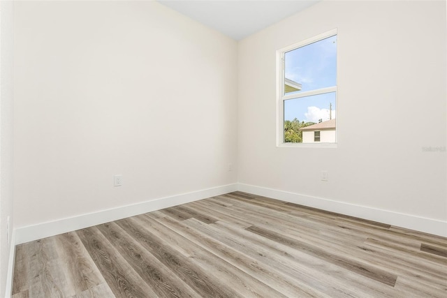 spare room with light wood-type flooring