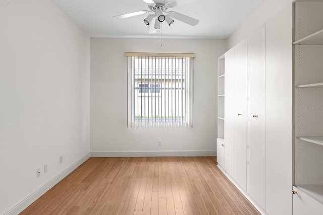 unfurnished bedroom featuring ceiling fan and light hardwood / wood-style floors