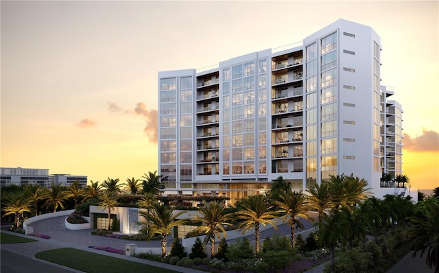 view of outdoor building at dusk