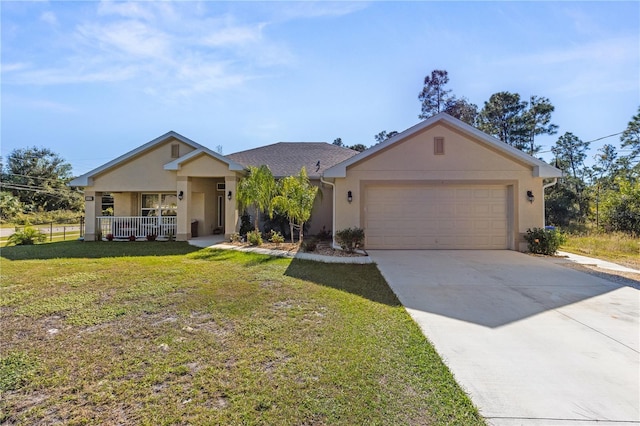 ranch-style house featuring covered porch, a front yard, and a garage