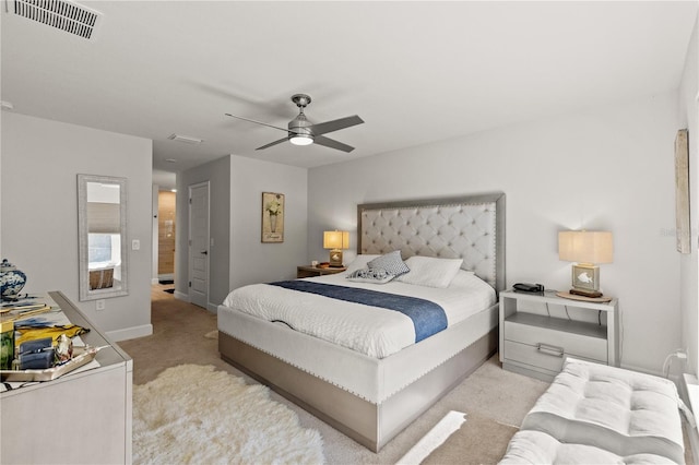 bedroom featuring ceiling fan, baseboards, visible vents, and light colored carpet