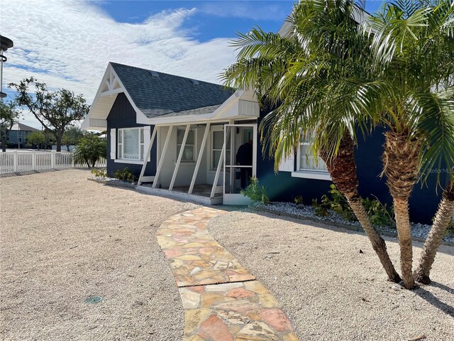 view of front of property with a sunroom