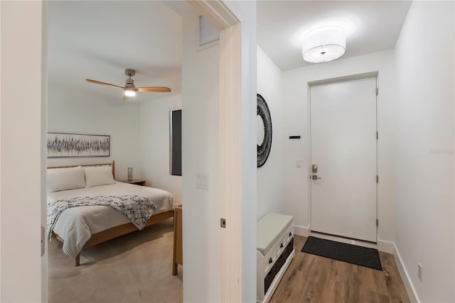 bedroom featuring ceiling fan and wood-type flooring