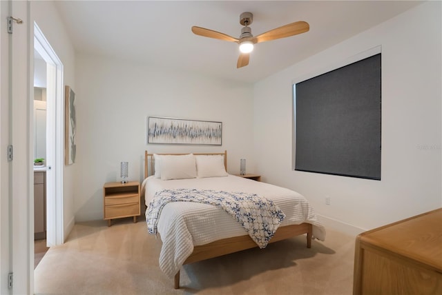 bedroom featuring ceiling fan and light carpet