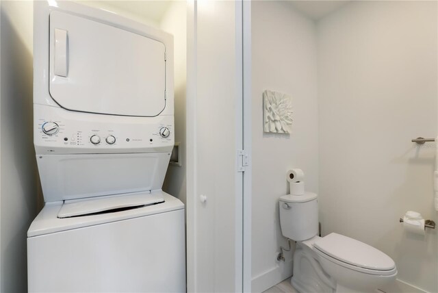 laundry room with stacked washer and clothes dryer