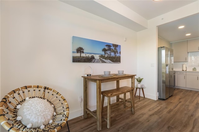 dining space featuring dark hardwood / wood-style flooring