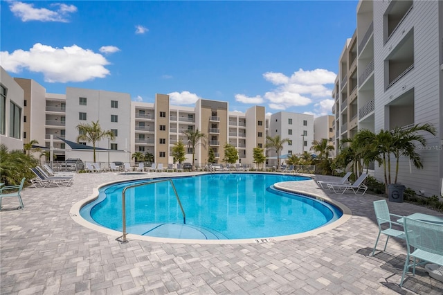 view of swimming pool featuring a patio area