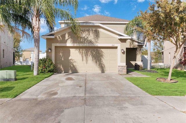 view of front facade featuring a garage and a front lawn