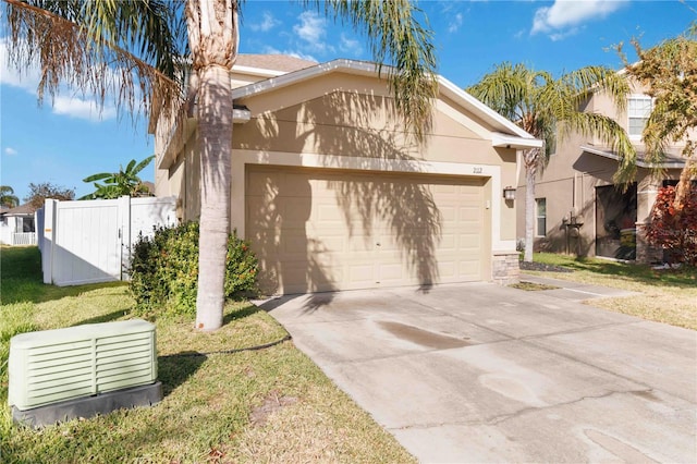 view of front of home featuring a front yard and a garage