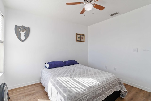 bedroom featuring light hardwood / wood-style floors and ceiling fan